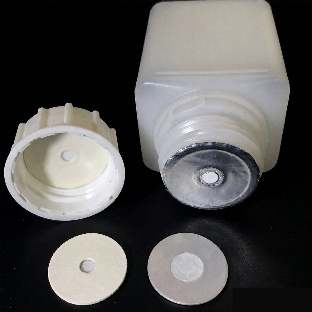 Vented liner shown with an agrochemical bottle and cap